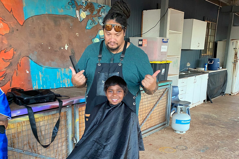 Boy getting a haircut.