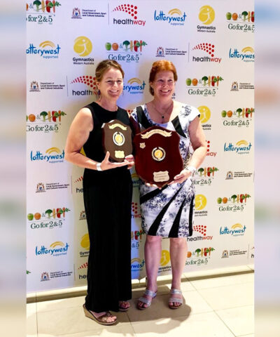 Two women holding Gym WA awards.
